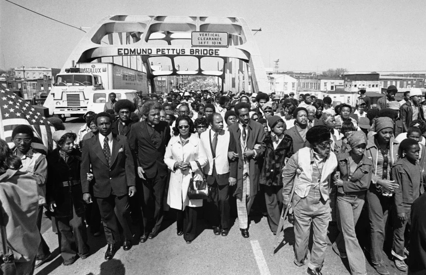 On March 8, 1975, Father James Robinson, Mrs. Coretta Scott King (widow of Dr. Martin Luther King, Jr., center), and Rep.&nbsp;John Lewis led&nbsp;a crowd of 5,000 across the Edmund Pettus Bridge in Selma, Alabama.
Courtesy of NBC News
