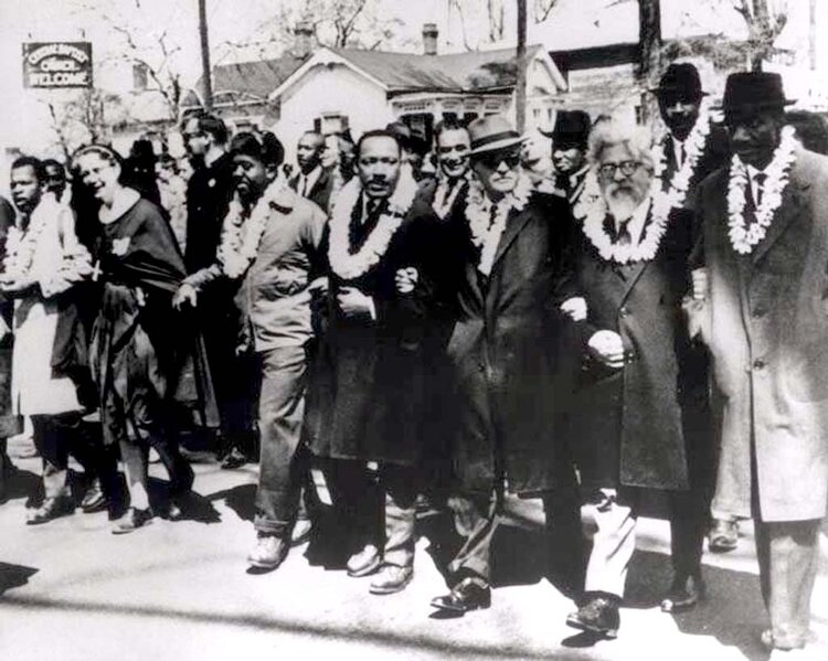 Dr. Martin Luther King, Jr. (center) and Rabbi Abraham Heschel (second from right) march from Selma to Montgomery, Alabama, March 21, 1965